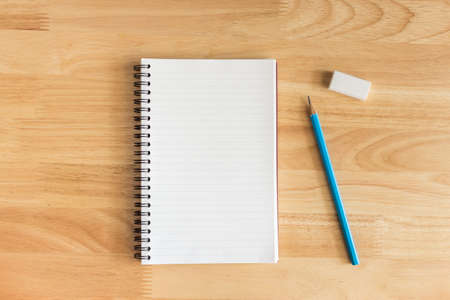 Notebook  on wooden background.の写真素材
