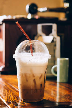 Iced cappuccino in coffee shop. Vintage tone.の写真素材