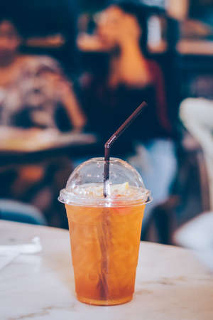 Glass of iced lemon tea  in the cafe. Summer drink.の写真素材