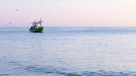 boat in the sea in the beautiful sunrise.