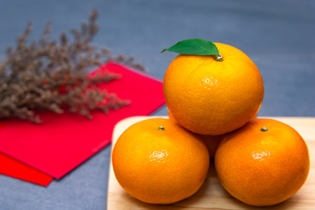 Lunar New Year (Chinese New Year) concept.  - Mandarin oranges and red packet with copy space.の写真素材