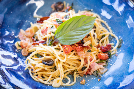 Close-up of Stir-Fried Spaghetti With Dried Chili And Crispy Baconの写真素材
