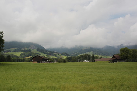 View of fog mountains and grassの写真素材