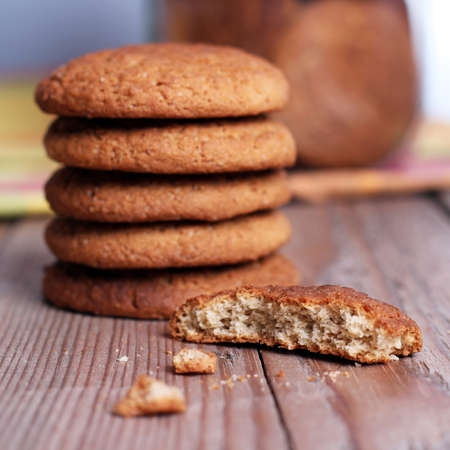 Fresh oatmeal cookies in a pile with broken cookieの写真素材