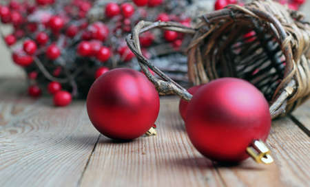 Christmas decorations with balls, brown basket and a ribbonの写真素材
