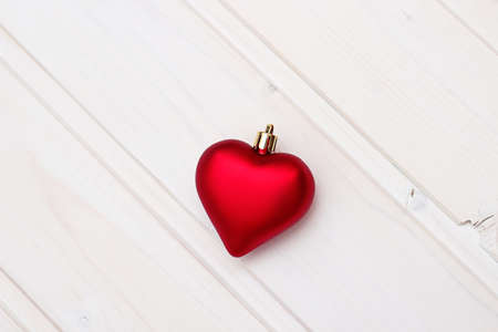 Red christmas heart on a wooden background. Copy space backgroundの写真素材