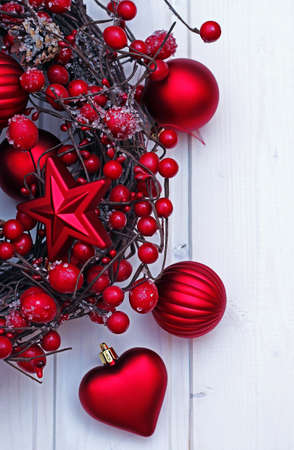 Christmas ribbon with red balls on a wooden background. Selective focusの写真素材