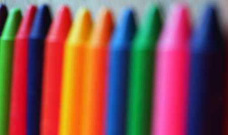 Background with colored oil pastel crayons. Out of focus imageの写真素材