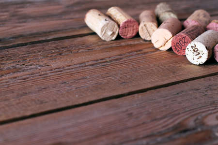Wine corks lying on a wooden table. Selective focus. Copy space backgroundの写真素材
