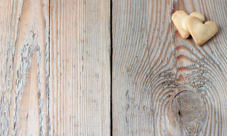 Heart shape cookies on a wooden table for Valentine's day. Copy space backgroundの写真素材