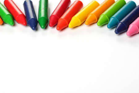 Crayons lying on a paper. Selective focus, copy space backgroundの写真素材