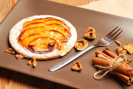 Homemade apple pie on a wooden background. Selective focus