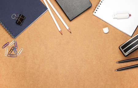 Still life, business, education concept. Office supplies, notepad, diary, stapler, USB flash drive and pencils on a table. Selective focus, copy space background, top viewの写真素材