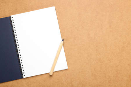 Still life, business, education concept. Office supplies, notepad and a pencil on a table. Selective...
