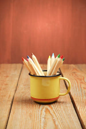 Still life, business, education concept. Pencils in a mug on a wooden table. Selective focus, copy space backgroundの写真素材