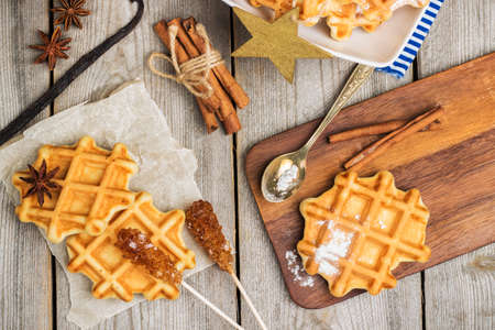 Still life, food and drink, breakfast concept. Homemade belgian waffles on a rustic wooden table. Selective focus, top viewの写真素材