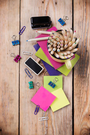 Business, education, office still life concept. Accessories, supplies, mug with pencils on rustic wooden table. Selective focus, copy space background, top view, flat layの写真素材