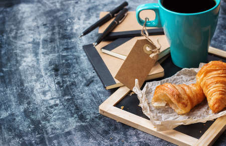 Education, business office breakfast concept. Stationery, supplies, pencil, pen, note, croissant and...