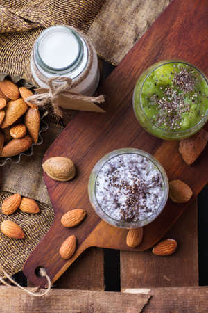 Healthy chia seed pudding with almond milk and fresh fruit topping. Selective focus, top view, overhead flat layの写真素材