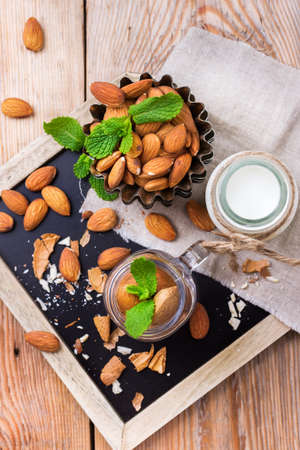 Almond milk with ingredients for healthy vegetarian vegan breakfast, top view overhead flat layの写真素材