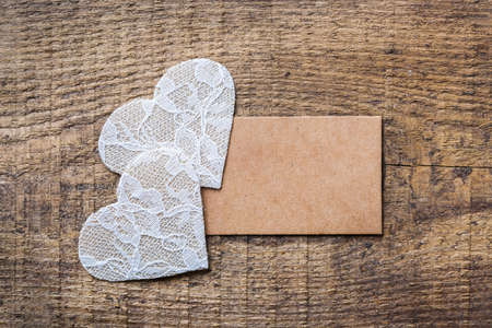 Love and still life concept. Valentines day holiday gift card on a rustic wooden table. Top view flat lay overhead, copy space backgroundの写真素材