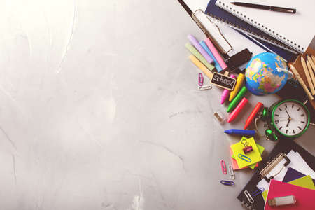 Back to school, business office education concept. Assortment of supplies, crayons, pens, notebook on a table.Top view flat lay overhead, toned imageの写真素材
