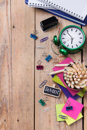 Business, education, office still life concept. Accessories, supplies, mug with pencils on rustic wooden table. Copy space background, flat lay, top viewの写真素材