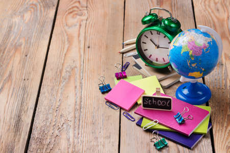 Business, education, office still life concept. Accessories, supplies, mug with pencils on rustic wooden table. Copy space backgroundの写真素材