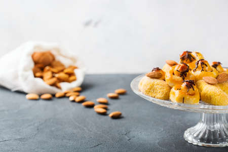 Food and drink, holidays tea time concept. Almond marzipan pastry, cookies, biscuits, sweets on a cozy table.の写真素材