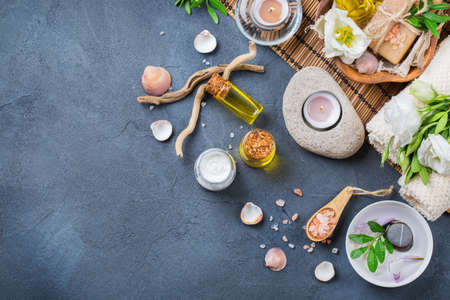 Spa still life wellness setting concept. Assortment of essential oil cream sea salt natural soap...