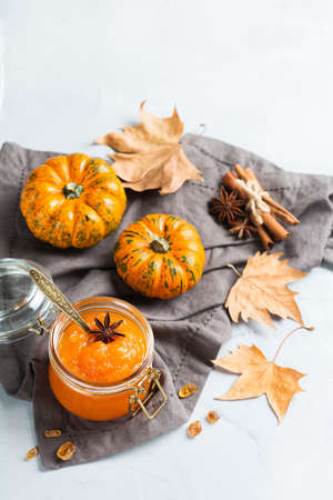 Food and drink, still life, thanksgiving harvest fall autumn concept. Pumpkin jam or confiture with spices on a cozy kitchen tableの写真素材