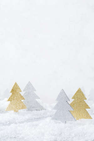 New year holiday concept. White winter snow christmas forest for greeting card. Copy space backgroundの写真素材