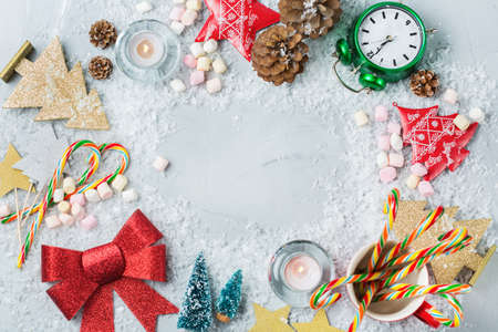Christmas new year holiday concept. Festive decoration for greeting card with christmas symbols, tree clock star candles. Flat lay top view copy space backgroundの写真素材