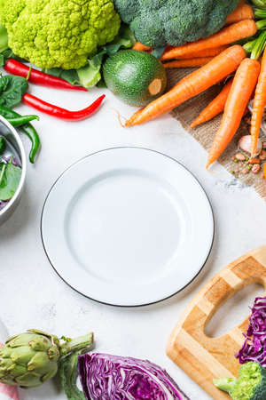 Assortment of fresh organic farmer vegetables food for cooking vegan vegetarian, diet and nutrition concept. Top view flat lay overhead, copy space backgroundの写真素材