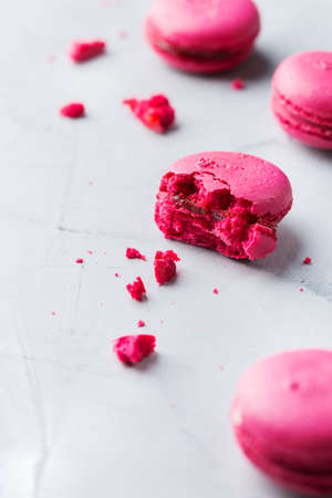 Food and drink, sweet romantic food concept. Handmade pink violet macaroons on a modern table