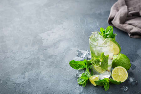 Food and drink, holidays party concept. Cold fresh classic beverage alcohol cocktail mojito lemonade...