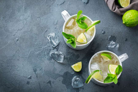 Food and drink, holidays party concept. Cold fresh classic beverage moscow mule cocktail in a silver...