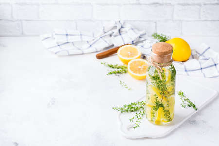 Health care, fitness, healthy nutrition diet concept. Fresh cool lemon thyme infused water,...