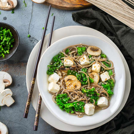 Buckwheat soba noodles tofu soup ingredients for asian chinese japanese korean vietnamese food. Top view flat lay kitchen cooking backgroundの写真素材