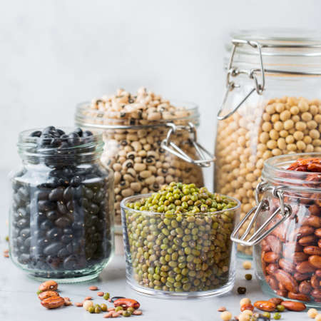 Healthy food, dieting, nutrition concept, vegan protein source. Assortment of colorful legumes in...