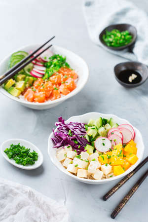 Fast and healthy food, lunch, nutrition concept. Fresh organic hawaiian salmon and tofu poke bowl...