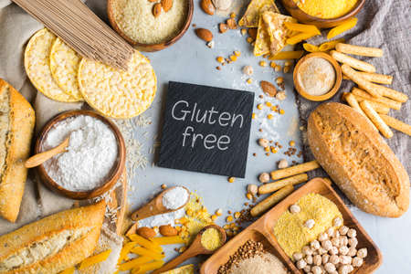 Healthy eating, dieting, balanced food concept. Assortment of gluten free food and flour, almond, corn, rice on a table. Top view flat lay backgroundの写真素材