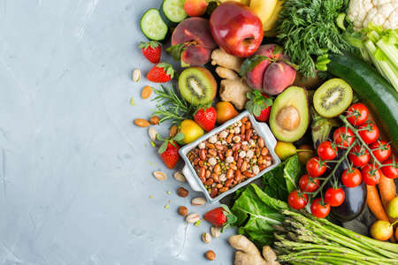 Balanced nutrition concept for clean eating alkaline diet. Assortment of healthy food ingredients for cooking on a kitchen table. Top view flat lay backgroundの写真素材
