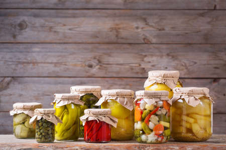 Preserved and fermented food. Assortment of homemade jars with variety of pickled and marinated...