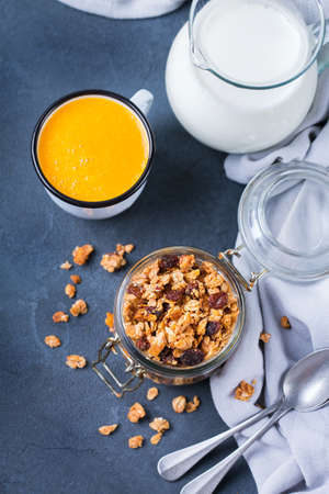 Healthy clean eating, dieting and nutrition, fitness, balanced food, breakfast concept. Homemade granola muesli with ingredients on a table. Top view flat lay background の写真素材