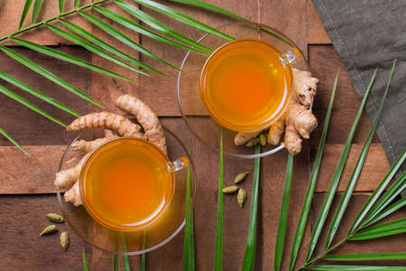 Healthy immune system booster, cold and flu remedy. Turmeric ginger lemon beverage, anti...