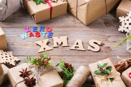 Creative zero waste Christmas concept. Gift boxes with handmade eco friendly craft wrapping paper and traditional Japanese style furoshiki fabric packaging.の写真素材