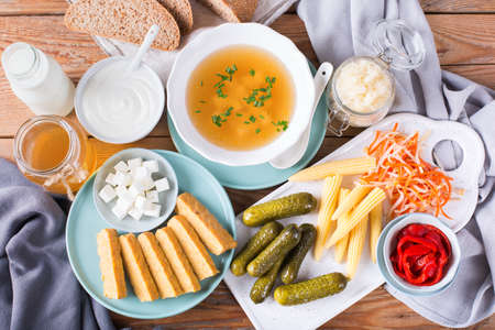 Postbiotics - metabolites and cell-wall components from probiotics, functional food. Tempeh, kombucha, sauerkraut, pickles, kefir, yogurt, miso soup, soft cheese, sourdough breadの写真素材