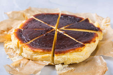 Homemade Basque burnt cake, New York style Cheesecake with cracked crust. Trendy local food from San Sebastian, Spain. Easy for home cookingの写真素材