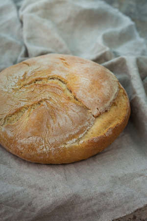 Fresh loaf of homemade bread on a table